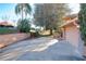 House with attached garage and landscaped driveway at 9835 Lakeshore Dr, Clermont, FL 34711