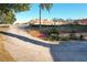 Curved driveway leading to house with landscaping and distant construction at 9835 Lakeshore Dr, Clermont, FL 34711