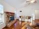 Brick fireplace is a focal point in the living room at 9835 Lakeshore Dr, Clermont, FL 34711