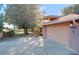 Two-car garage with brick exterior and landscaping at 9835 Lakeshore Dr, Clermont, FL 34711