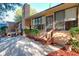 Rear house view, showcasing patio and landscaping at 9835 Lakeshore Dr, Clermont, FL 34711