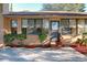 House exterior with patio, landscaping, and steps at 9835 Lakeshore Dr, Clermont, FL 34711
