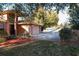 House exterior with attached garage and landscaping at 9835 Lakeshore Dr, Clermont, FL 34711