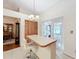 Kitchen boasts a breakfast bar and views to the backyard at 9835 Lakeshore Dr, Clermont, FL 34711