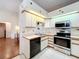 Kitchen with stainless steel appliances at 9835 Lakeshore Dr, Clermont, FL 34711