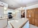 Kitchen with island and stainless steel appliances at 9835 Lakeshore Dr, Clermont, FL 34711