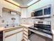 Kitchen with stainless steel appliances at 9835 Lakeshore Dr, Clermont, FL 34711