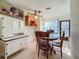 Bright kitchen features a built-in hutch and vintage cabinetry at 9835 Lakeshore Dr, Clermont, FL 34711