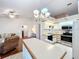 Eat-in kitchen with stainless steel appliances and island at 9835 Lakeshore Dr, Clermont, FL 34711
