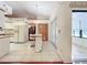 Galley kitchen with access to Gathering room and screened porch at 9835 Lakeshore Dr, Clermont, FL 34711