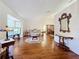 Elegant living room showcasing hardwood floors, bay window, and ornate furniture at 9835 Lakeshore Dr, Clermont, FL 34711