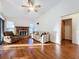 Bright living room with fireplace and hardwood floors at 9835 Lakeshore Dr, Clermont, FL 34711