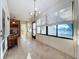 Sunroom with tiled floors and access to outside at 9835 Lakeshore Dr, Clermont, FL 34711