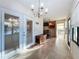Sunroom features tiled floors and a chandelier at 9835 Lakeshore Dr, Clermont, FL 34711