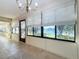 Sunroom boasts lake views and a tranquil atmosphere at 9835 Lakeshore Dr, Clermont, FL 34711
