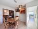 Sunroom with access to kitchen and dining areas at 9835 Lakeshore Dr, Clermont, FL 34711