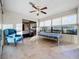 Sunroom with ceiling fan, daybed and comfy chairs at 9835 Lakeshore Dr, Clermont, FL 34711