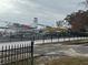 Two seaplanes on the water near a fence and walkway at 1001 Michelle Ct, Tavares, FL 32778