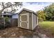 Well-maintained storage shed in backyard, offering extra storage space at 1001 Michelle Ct, Tavares, FL 32778