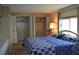 King-size bed in sunny bedroom with two large closets at 101 Mango Cv, Leesburg, FL 34748