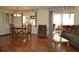 Dining area with hardwood floors and access to screened porch at 101 Mango Cv, Leesburg, FL 34748