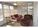 Additional seating in sunroom at 101 Mango Cv, Leesburg, FL 34748