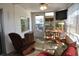 Relaxing screened porch with seating at 101 Mango Cv, Leesburg, FL 34748