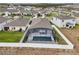 Aerial view showcasing the home's private pool and location within the community at 1115 Calico Pointe Cir, Groveland, FL 34736