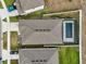 Overhead view of house with fenced backyard and pool at 1115 Calico Pointe Cir, Groveland, FL 34736
