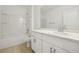 Clean bathroom with white vanity, bathtub, and tiled floors at 1115 Calico Pointe Cir, Groveland, FL 34736