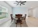 Cozy dining area with round table and four chairs at 1115 Calico Pointe Cir, Groveland, FL 34736