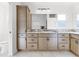 Bathroom with double vanity and light brown cabinets at 11415 Roma Rd, Oxford, FL 34484