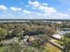 Aerial view showcasing home's location on a large lot near the lake at 1281 Gray Ct, Eustis, FL 32726