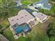 Aerial view of home, pool, and detached garage at 1281 Gray Ct, Eustis, FL 32726