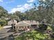 Aerial view of a ranch home with a large lot and detached garage at 1281 Gray Ct, Eustis, FL 32726
