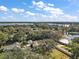 Aerial view of a house near the lake, showcasing the property and surrounding landscape at 1281 Gray Ct, Eustis, FL 32726