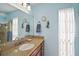 Bathroom with granite vanity, shower, and updated fixtures at 1281 Gray Ct, Eustis, FL 32726
