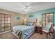 Bedroom with a ceiling fan, window blinds, and a queen bed at 1281 Gray Ct, Eustis, FL 32726