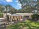 Charming ranch home with lush landscaping, and a spacious yard at 1281 Gray Ct, Eustis, FL 32726