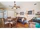 Game room with wet bar, seating area and hardwood floors at 1281 Gray Ct, Eustis, FL 32726