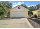 Detached garage with automatic door opener at 1281 Gray Ct, Eustis, FL 32726