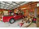Garage with truck, kayaks, and workshop area at 1281 Gray Ct, Eustis, FL 32726