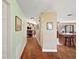 Bright hallway with hardwood floors, leading to living areas at 1281 Gray Ct, Eustis, FL 32726