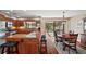 Spacious kitchen boasts granite countertops, stainless steel appliances, and hardwood floors at 1281 Gray Ct, Eustis, FL 32726