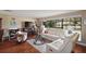 Spacious living room with hardwood floors, fireplace, and large windows at 1281 Gray Ct, Eustis, FL 32726