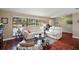 Relaxing living room with hardwood floors and ample natural light at 1281 Gray Ct, Eustis, FL 32726