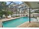 Refreshing pool with screened enclosure and ample patio space at 1281 Gray Ct, Eustis, FL 32726