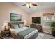 Comfortable main bedroom with large TV, and plenty of natural light at 12907 Slash Pine Ct, Clermont, FL 34711