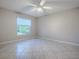 Bedroom with tile floors, window blinds, and garden view at 1320 Arredondo Dr, The Villages, FL 32162