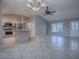 Open concept kitchen and living area with tile floors at 1320 Arredondo Dr, The Villages, FL 32162